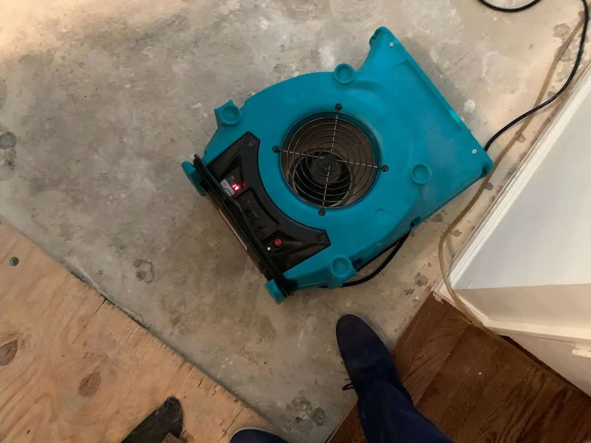 Air mover drying subfloor during Leak Detection & Repair in Grand Rapids